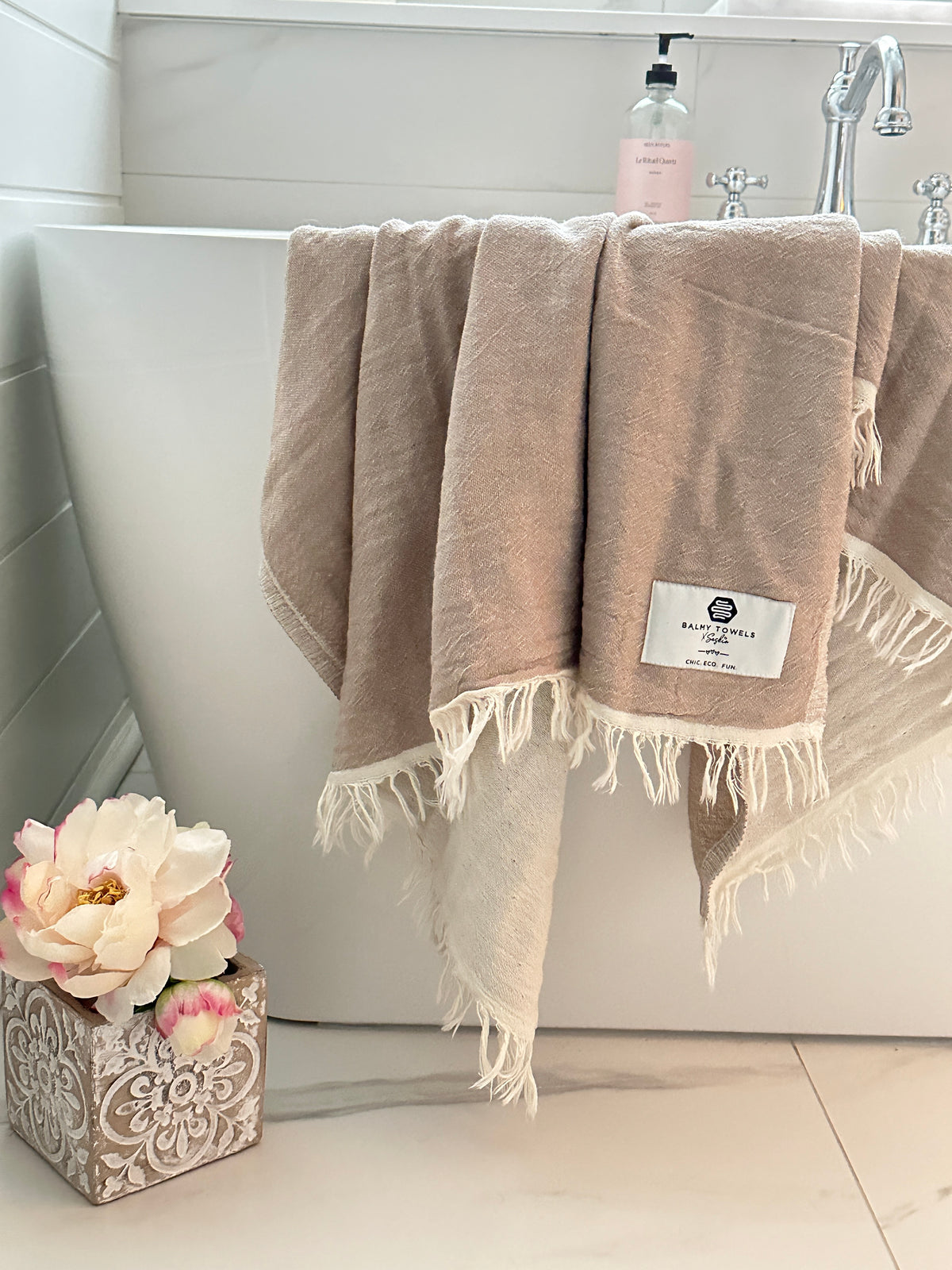 Napoli Towel stone beige on the side of the bathtub