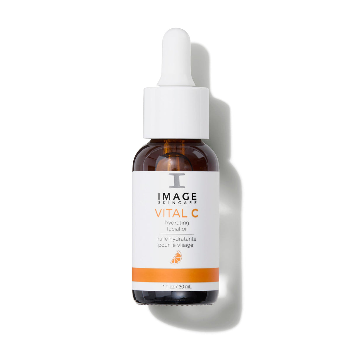Flacon compte-gouttes ambré à étiquette blanche et orange, huile hydratante pour le visage VITAL C d’Image Skincare, 30 ml